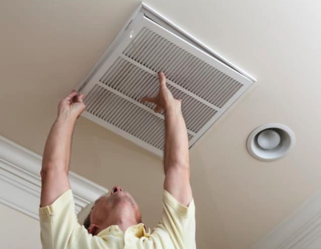 Man working on AC System